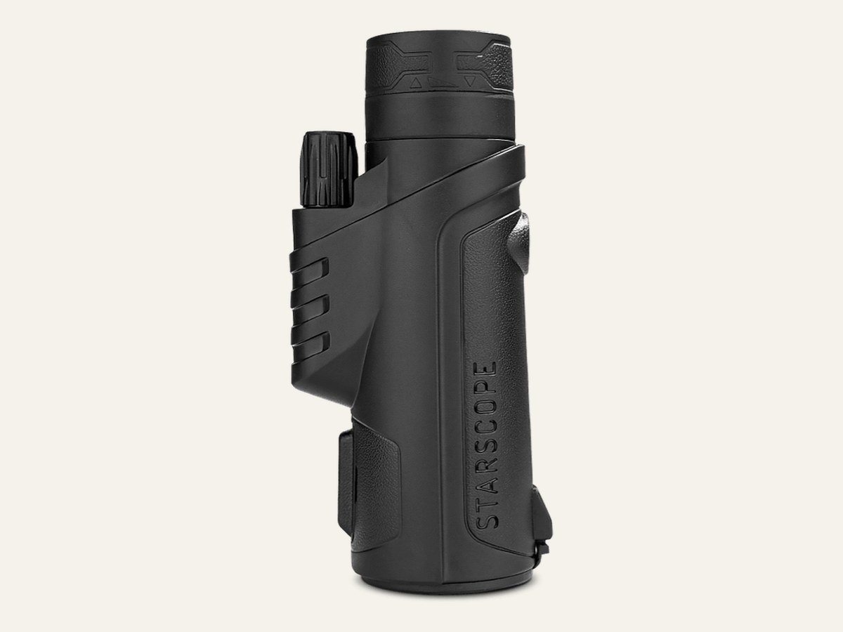 Black compact monocular standing upright
